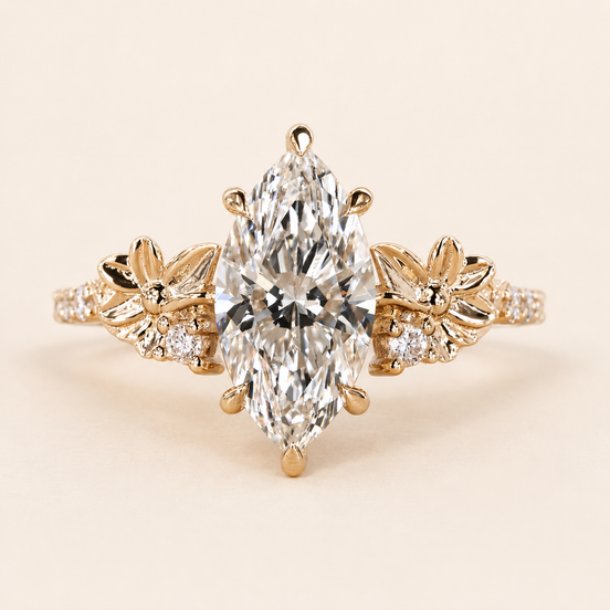 Marquise cut lab grown diamond floral engagement ring in yellow gold with sculptural flower-and-leaf shoulders