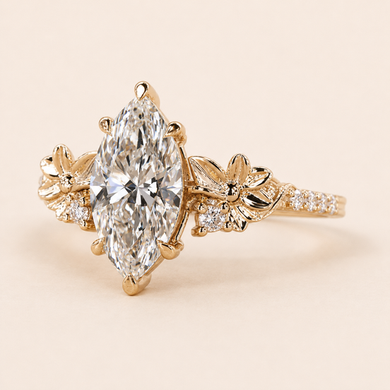 Marquise cut lab grown diamond floral engagement ring in yellow gold with sculptural flower-and-leaf shoulders