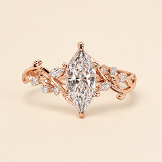 Dutch marquise lab grown diamond floral engagement ring in rose gold with leaf-and-vine shoulders and mixed diamond accents