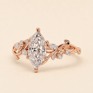 Dutch marquise lab grown diamond floral engagement ring in rose gold with leaf-and-vine shoulders and mixed diamond accents