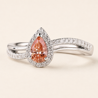 Pear cut pink Lab Grown Diamond halo engagement ring in white gold with split cathedral pavé shank