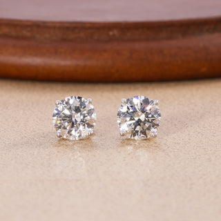Round lab grown diamond four-prong stud earrings in white gold