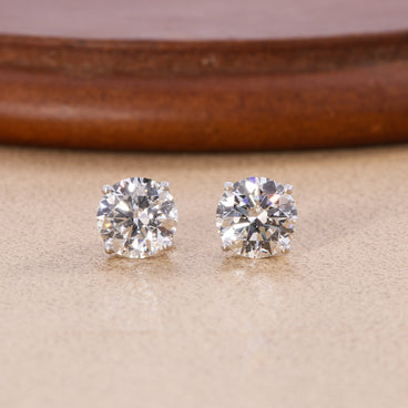 Round lab grown diamond four-prong stud earrings in white gold