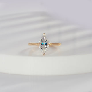Marquise cut lab grown diamond solitaire engagement ring in yellow gold with four-prong cathedral setting