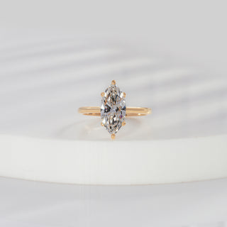 Marquise cut lab grown diamond solitaire engagement ring in yellow gold with six-prong setting and plain polished shank