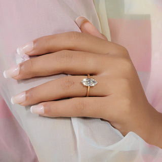 Marquise cut lab grown diamond solitaire engagement ring in yellow gold with six-prong setting and plain polished shank