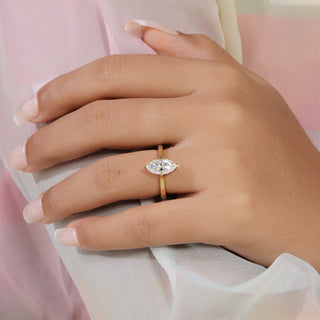 Marquise cut lab grown diamond solitaire engagement ring in yellow gold with four-prong cathedral setting