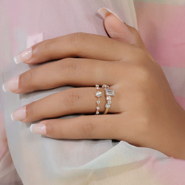 Emerald cut lab grown diamond stacking wedding ring set in yellow gold with baguette and round diamond bands