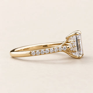 Emerald Cut Lab Grown Diamond Cluster Engagement Ring with round side diamonds in Yellow Gold