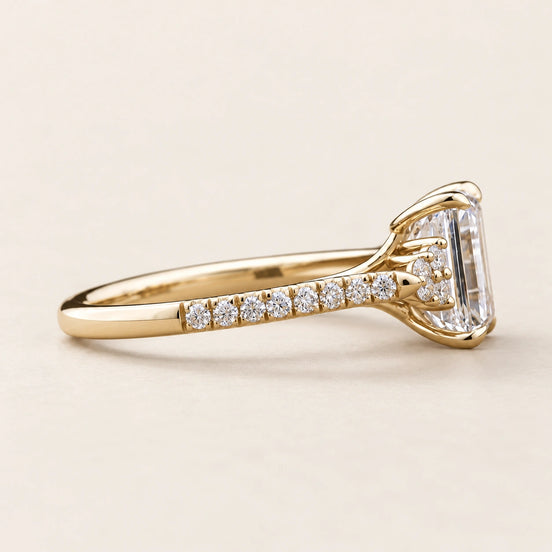 Emerald Cut Lab Grown Diamond Cluster Engagement Ring with round side diamonds in Yellow Gold