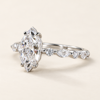 Marquise cut lab grown diamond engagement ring in white gold with elongated Dutch marquise center and alternating marquise and round diamond shoulders.