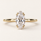 Marquise lab grown diamond engagement ring in yellow gold with eight rounded prongs in four pairs and a plain polished band