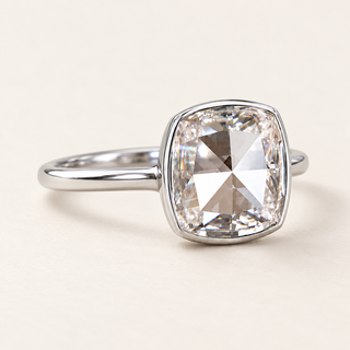 Square cushion rose cut lab grown diamond bezel engagement ring in white gold with rounded corners and narrow polished shoulders