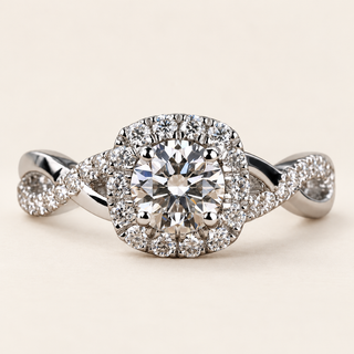 Round lab grown diamond split shank engagement ring in white gold with pavé halo, one diamond-set arm and one polished arm