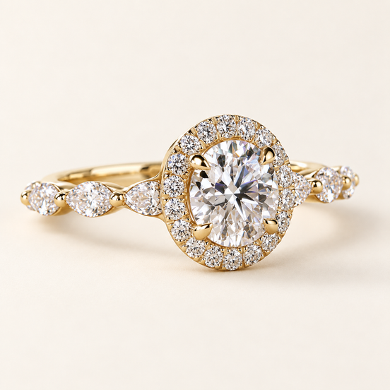 Round lab grown diamond halo engagement ring in yellow gold with four center prongs, pavé halo and marquise-and-round diamond shoulders