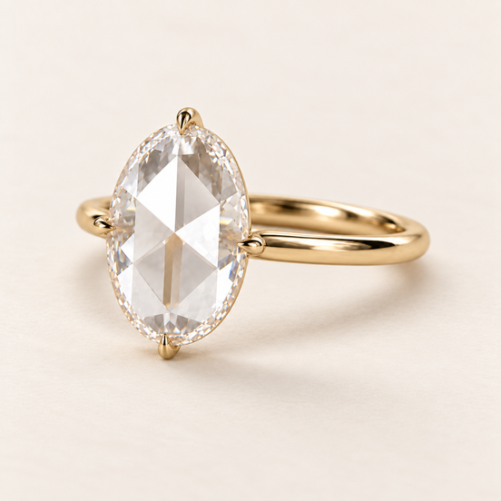 Oval rose cut lab grown diamond engagement ring in yellow gold with four claws at the ends and side midpoints and a plain polished band