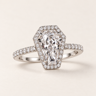 Coffin cut lab grown diamond halo engagement ring in white gold with four center prongs, geometric halo and pavé shoulders