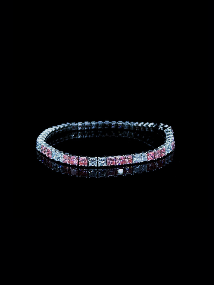White gold tennis bracelet with pink and white princess cut lab grown diamonds on black