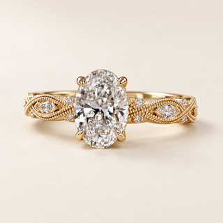 Oval cut lab grown diamond engagement ring with 1.00 ct center, marquise diamond leaf motifs, milgrain detailing and hidden halo in yellow gold.