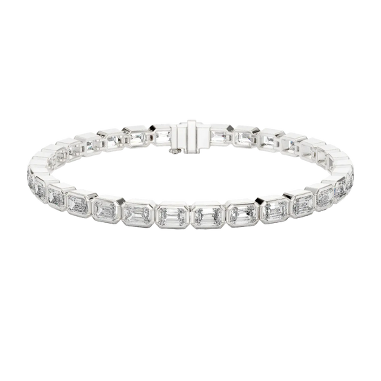 Silver bracelet with rectangular gemstones on a white background