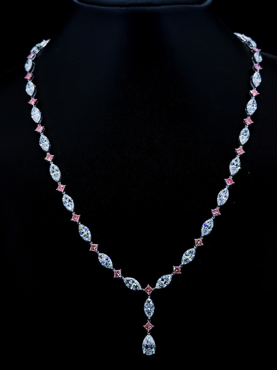 White gold necklace with pear, marquise and pink princess lab grown diamonds on black