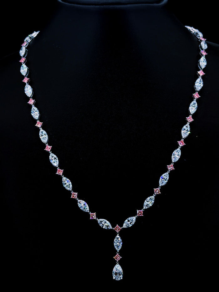 White gold necklace with pear, marquise and pink princess lab grown diamonds on black