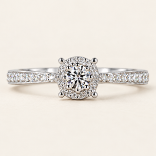 Round lab grown diamond pavé halo engagement ring in white gold with polished prongs and diamond-set shoulders
