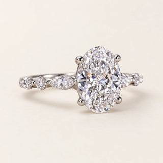 Oval Cut Lab Grown Diamond Four-Prong Engagement Ring with Marquise Side Stones in White Gold