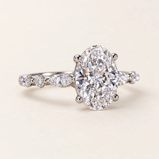 Oval Cut Lab Grown Diamond Four-Prong Engagement Ring with Marquise Side Stones in White Gold