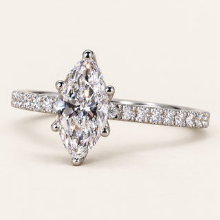 Marquise lab grown diamond engagement ring in white gold with six-prong center, protected tips and diamond-set shoulders
