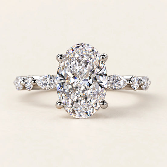 Oval Cut Lab Grown Diamond Four-Prong Engagement Ring with Marquise Side Stones in White Gold