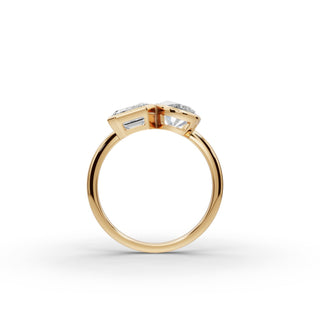 Emerald and Oval Lab Grown Diamond Bezel Toi et Moi Ring in yellow gold, front view
