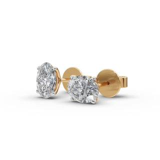 Oval Lab Grown Diamond Four Prong Stud Earrings in yellow gold, front view
