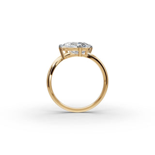 Pear and Emerald Lab Grown Diamond Basket Set Toi et Moi Ring in yellow gold, front view