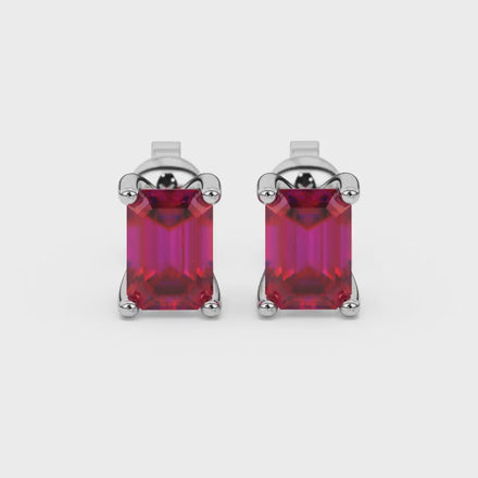 Emerald cut red gemstone solitaire stud earrings in rose gold four prong setting