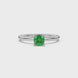 Green cushion cut gemstone ring with diamond gallery detailing in yellow gold