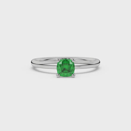 Green cushion cut gemstone ring with diamond gallery detailing in yellow gold