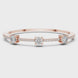 Elegant three stone round diamond bangle bracelet in gold with pavé accent diamonds by Signora Jewels