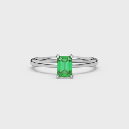 Emerald cut green gemstone solitaire ring in double band gold setting