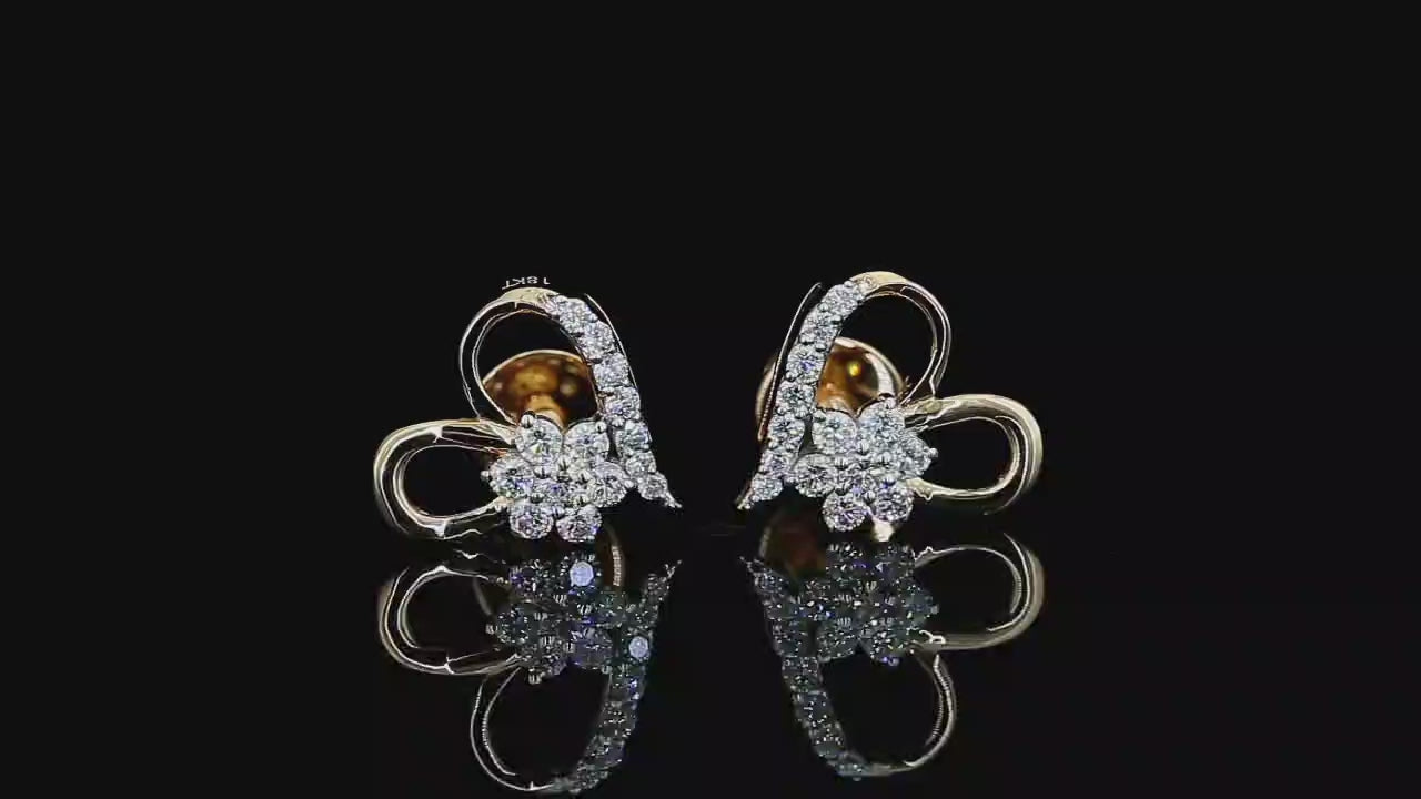Yellow gold floral heart earrings with round lab grown diamonds photographed on black