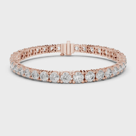 Graduated lab grown diamond tennis bracelet with varying size round diamonds in yellow white and rose gold