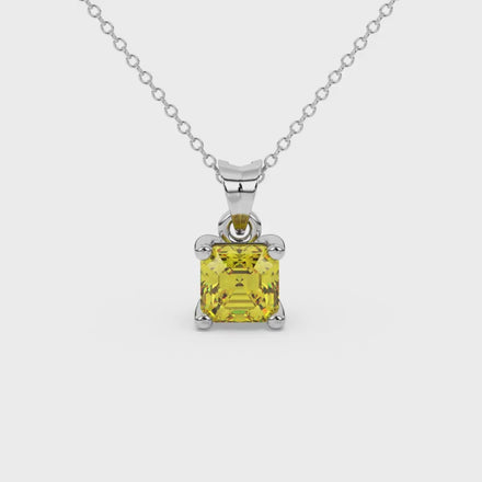 Asscher cut gemstone solitaire pendant in gold with secure four-prong basket setting
