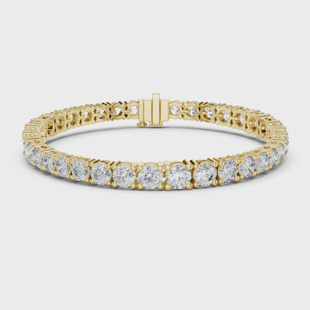 Graduated lab grown diamond tennis bracelet with varying size round diamonds in yellow white and rose gold