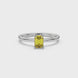Emerald cut yellow gemstone halo ring with round diamond halo and polished gold band