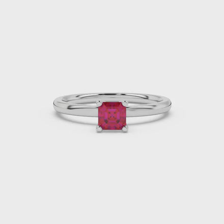 Asscher cut gemstone solitaire ring in gold with four-prong setting