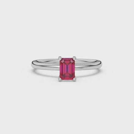 Emerald cut red gemstone solitaire ring with modern double shank design