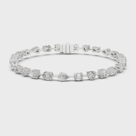 Multi shape lab grown diamond tennis bracelet with round heart oval pear and emerald cut diamonds in gold variations