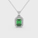 Emerald cut green gemstone halo pendant with round diamond accents