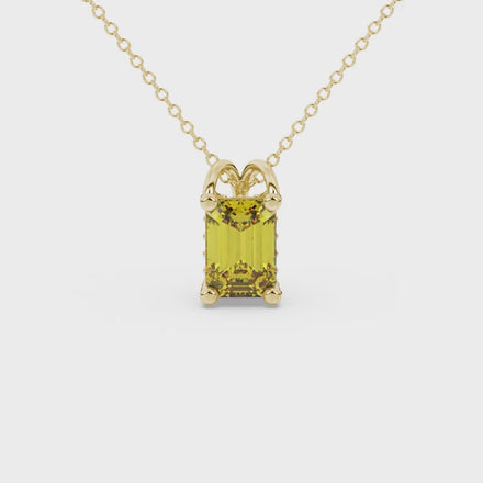 Emerald cut yellow gemstone solitaire pendant in yellow gold four prong setting