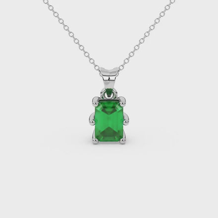 Emerald cut green gemstone solitaire pendant in gold with six prong setting